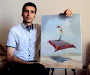 Художник Чингиз Мехбалиев нарисовал картину, посвященную цветку Хары бюльбюль (фото)