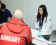 Делегации различных стран проходят аккредитацию на Кубок мира по спортивной гимнастике в Баку (ФОТОРЕПОРТАЖ)