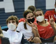 Борьба за медали - лучшие моменты третьего дня Всемирных соревнований среди возрастных групп по прыжкам на батуте и тамблингу в Баку (ФОТО)